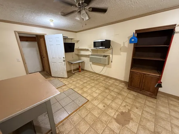 a view of a storage & utility room with two washing machine