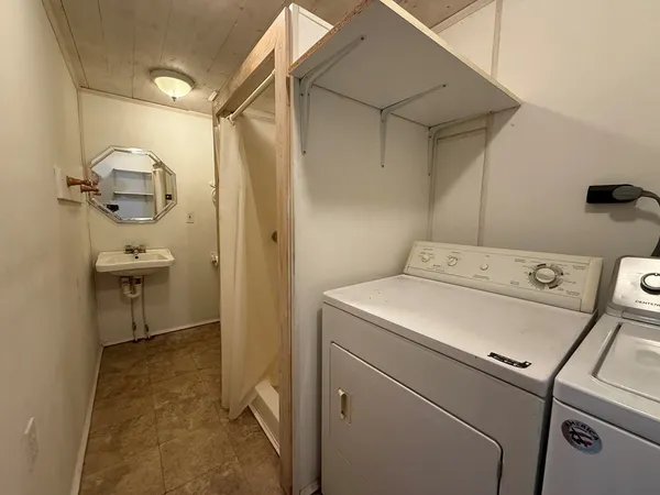 a utility room with dryer and washer