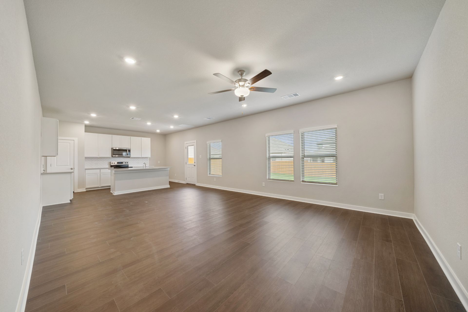 13801 Ryan Range Lane Elgin, TX 78621 - Photo 9 of 28 From Family Room to Open Concept Kitchen - Representative Photo
