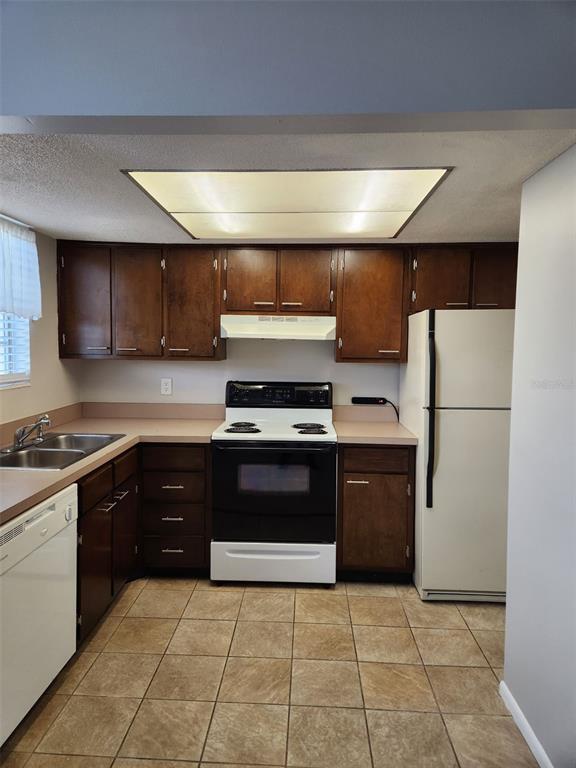 1500 Gay Road, Unit 5 Winter Park, FL 32789 - Photo 5 of 17 a kitchen with a refrigerator and a sink