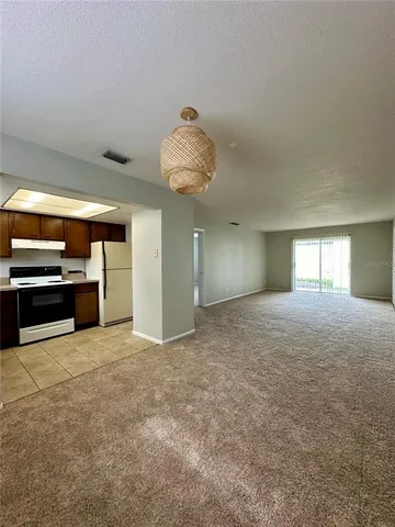 a view of a kitchen with a sink and a stove top oven