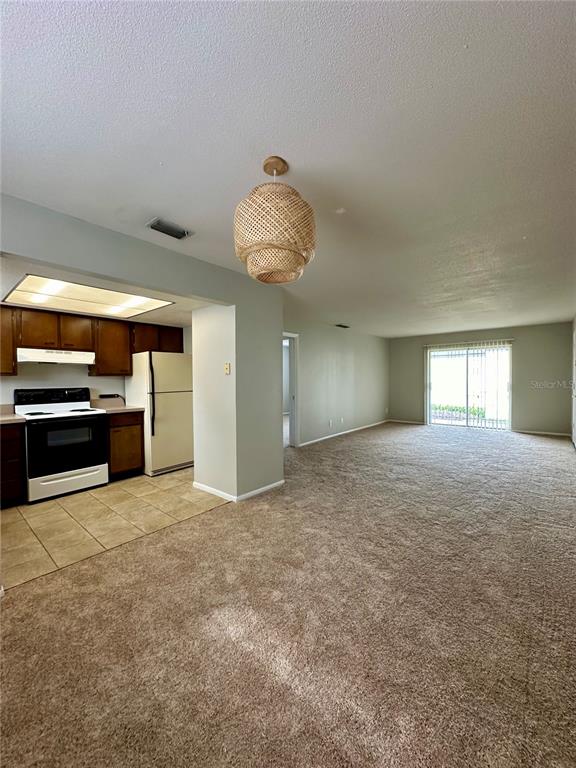 1500 Gay Road, Unit 5 Winter Park, FL 32789 - Photo 6 of 17 a view of a kitchen with a sink and a stove top oven