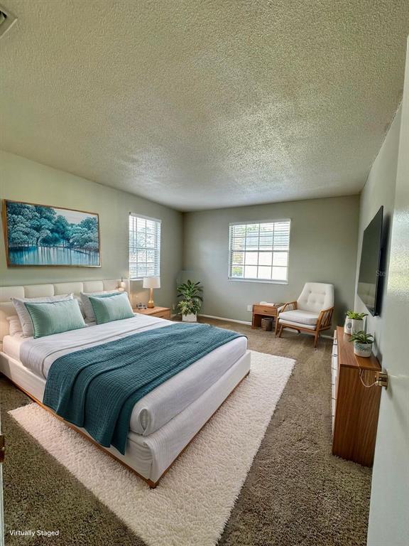 1500 Gay Road, Unit 5 Winter Park, FL 32789 - Photo 7 of 17 a bedroom with bed couch and window