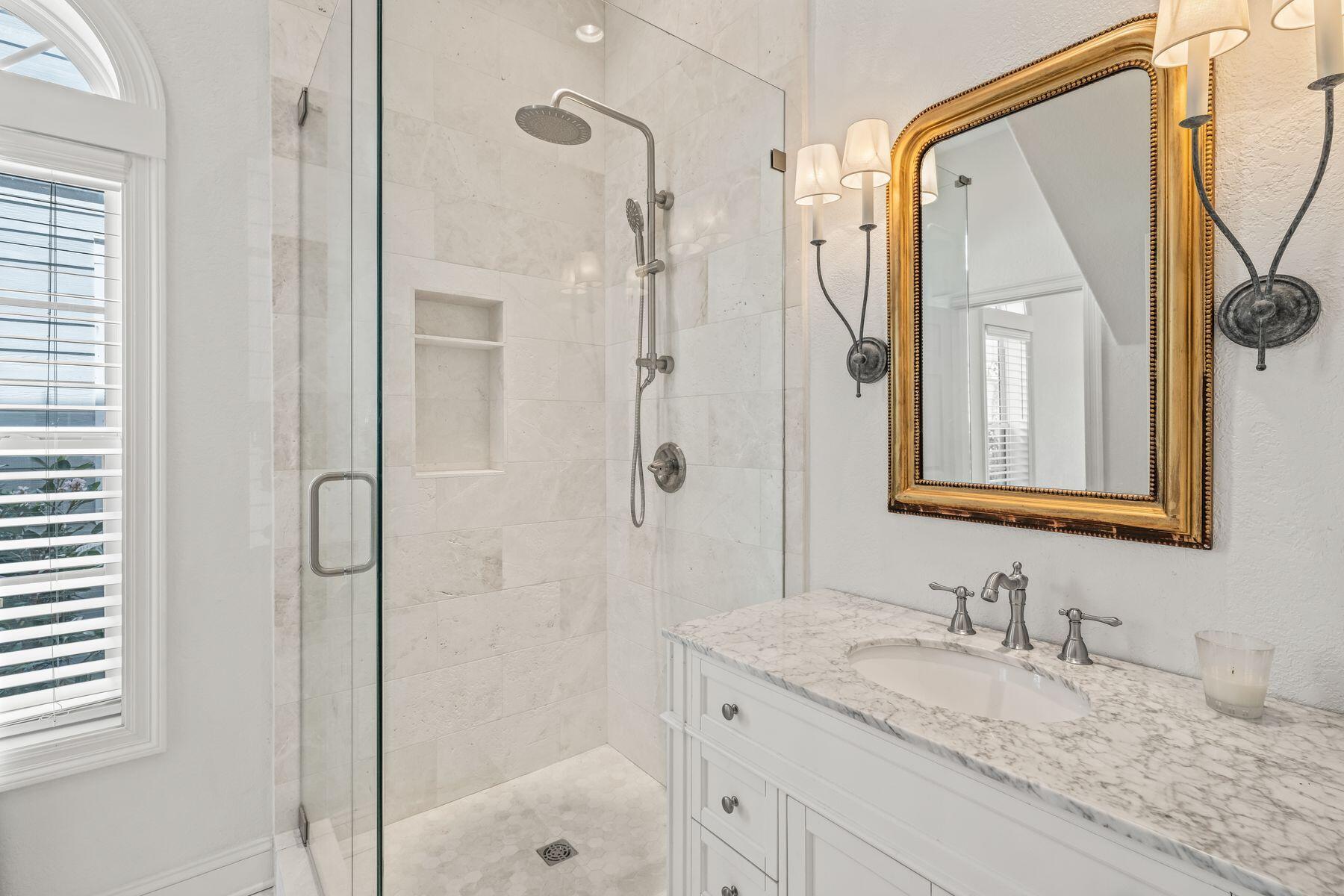 428 Beach Bike Way Seacrest, FL 32461 - Photo 12 of 32 a bathroom with a granite countertop sink a mirror and shower