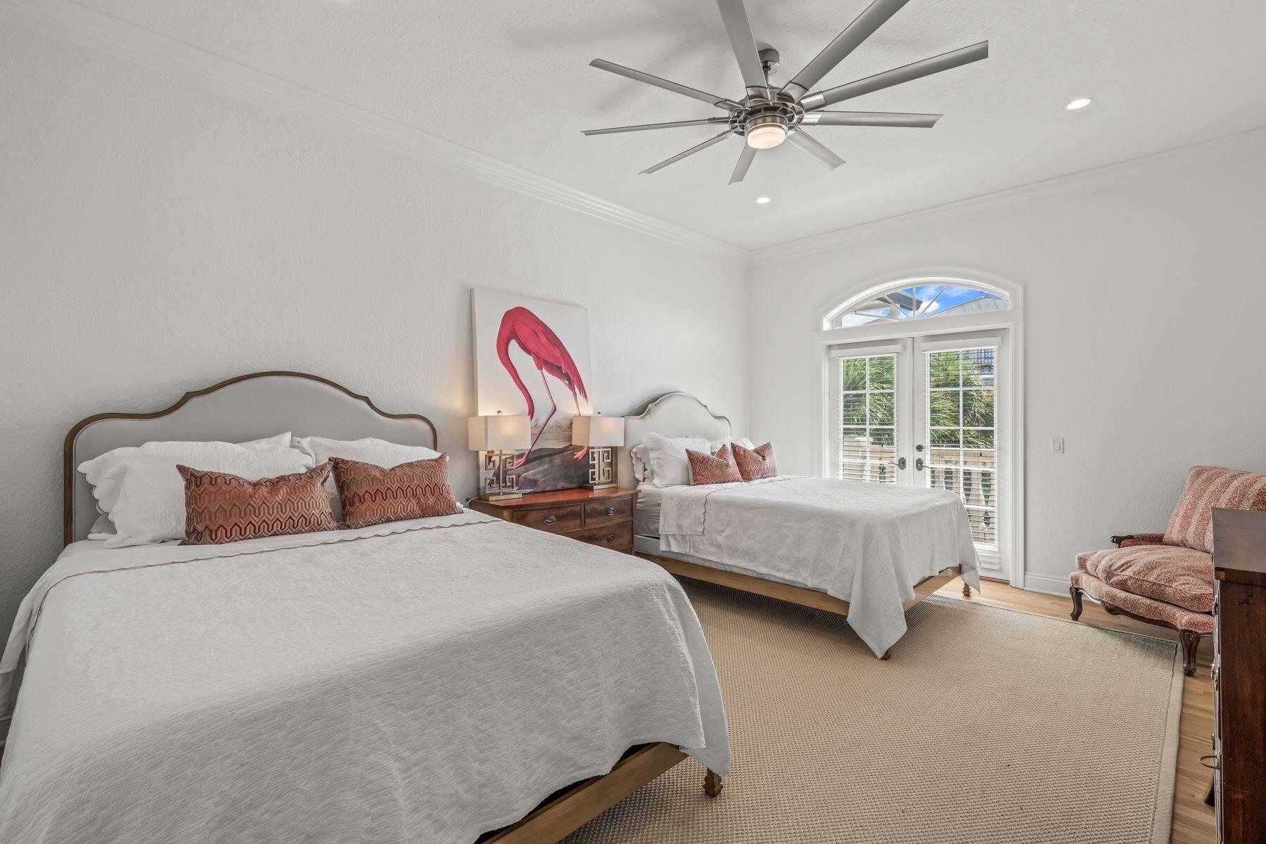 428 Beach Bike Way Seacrest, FL 32461 - Photo 14 of 32 a bedroom with two beds chandelier and a window