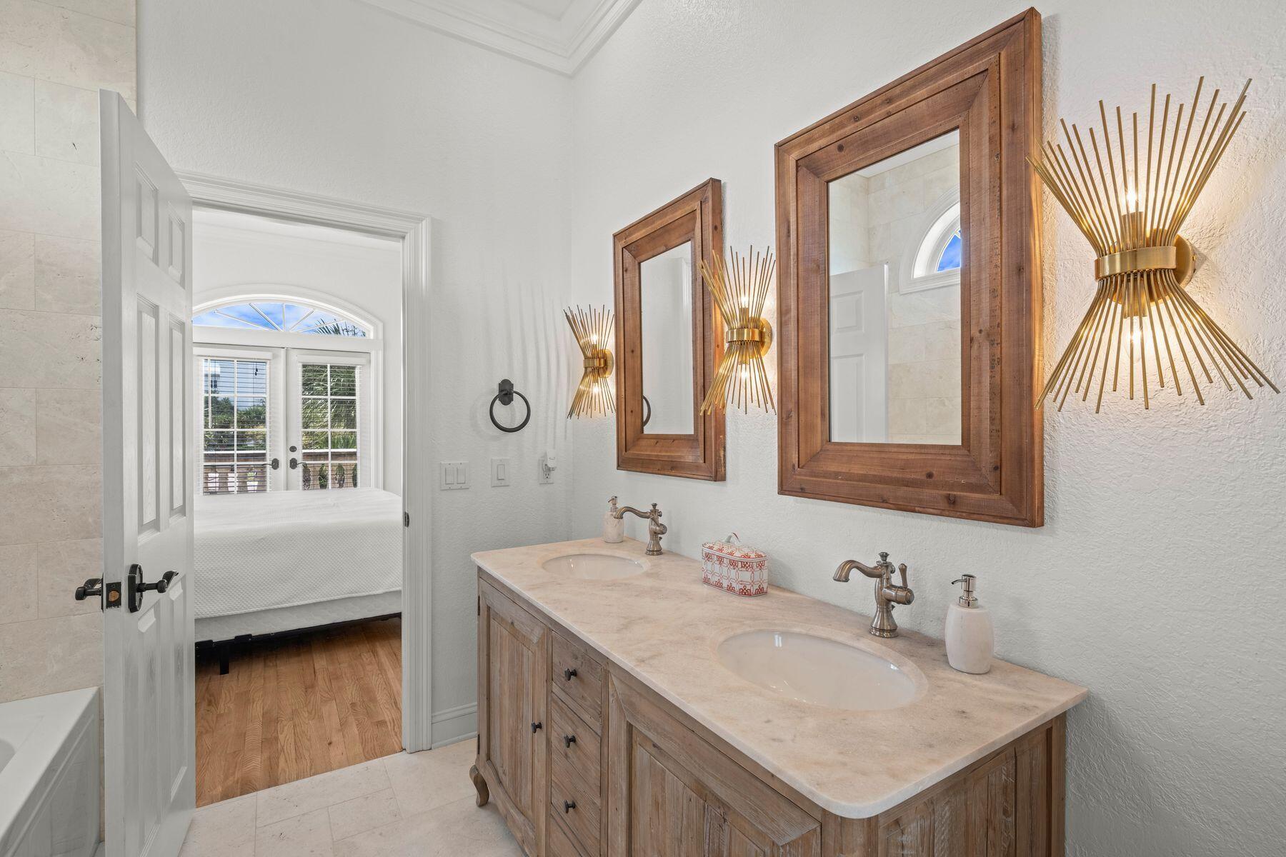 428 Beach Bike Way Seacrest, FL 32461 - Photo 15 of 32 a bathroom with a sink vanity and a mirror