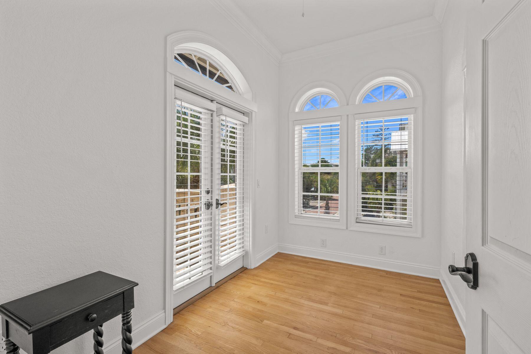 428 Beach Bike Way Seacrest, FL 32461 - Photo 22 of 32 a view of an entryway with wooden floor and windows