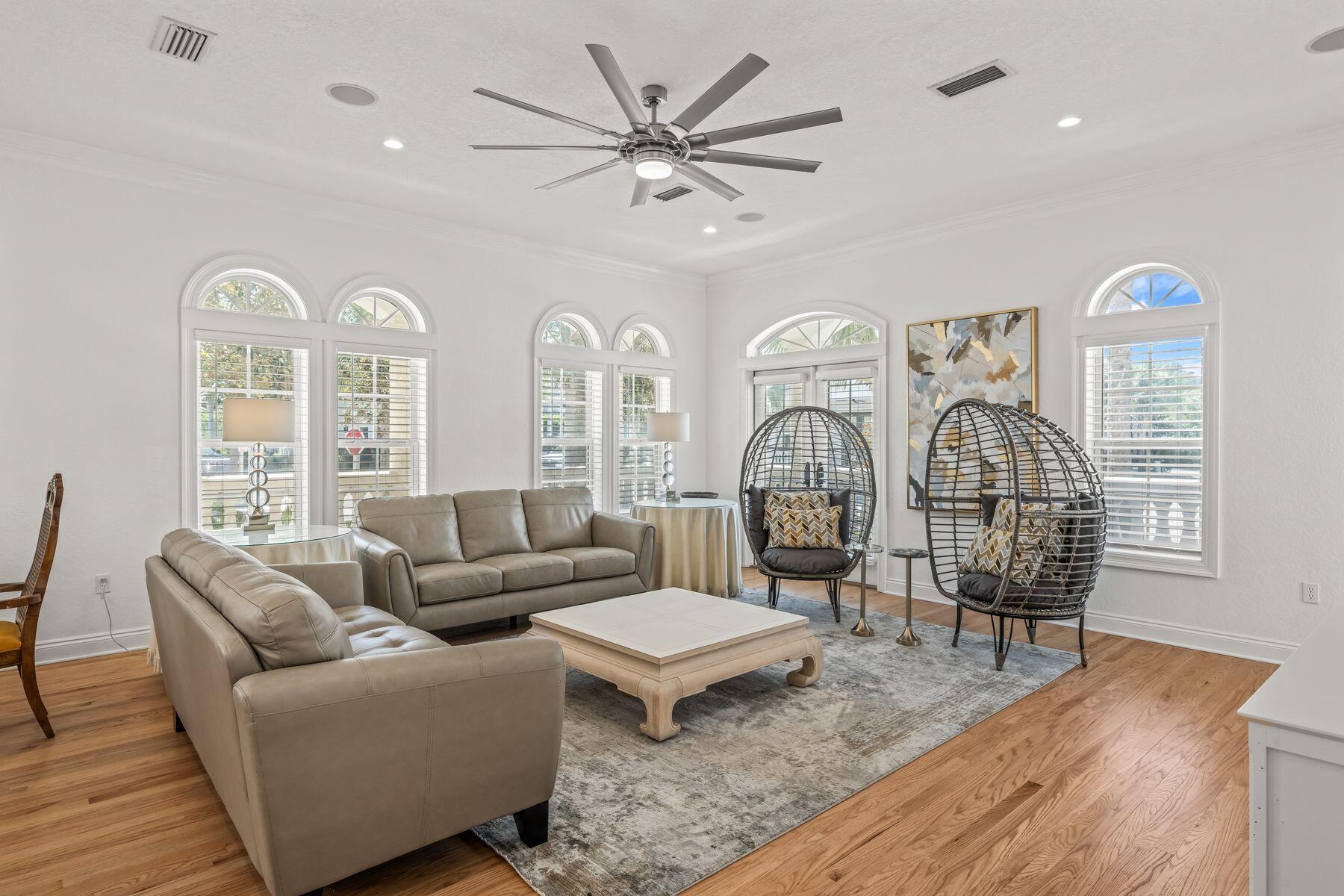 428 Beach Bike Way Seacrest, FL 32461 - Photo 5 of 32 a living room with furniture a chandelier and a wooden floor