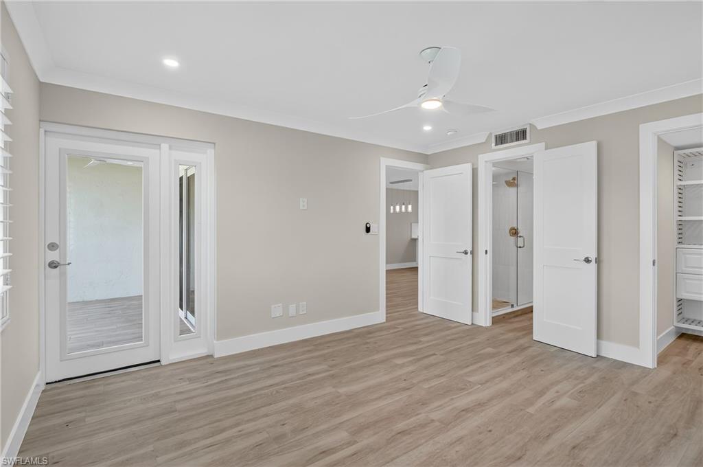 29 High Point Circle East, Unit 204 Naples, FL 34103 - Photo 11 of 29 a view of empty room with wooden floor