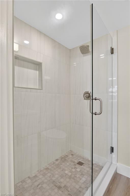29 High Point Circle East, Unit 204 Naples, FL 34103 - Photo 15 of 29 a bathroom with a shower