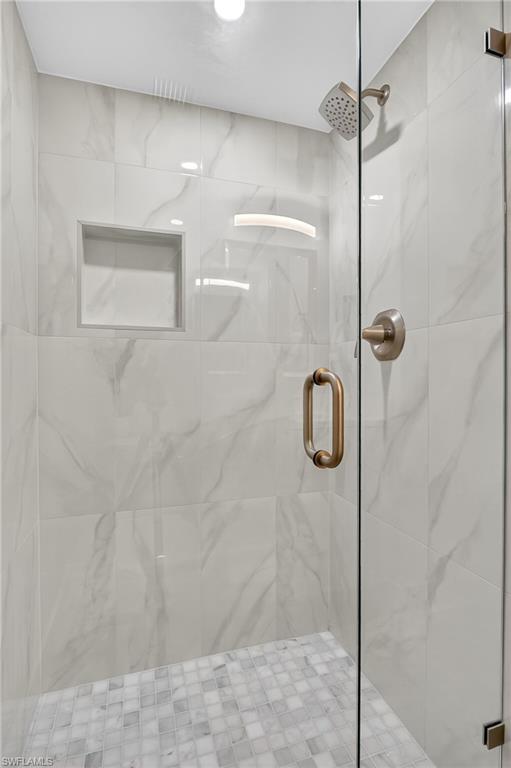 29 High Point Circle East, Unit 204 Naples, FL 34103 - Photo 21 of 29 a bathroom with a shower