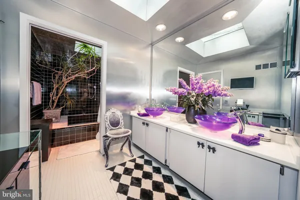 a kitchen with a sink and cabinets