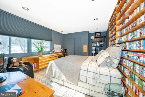 a bed room with a bed and a view of walk in closet