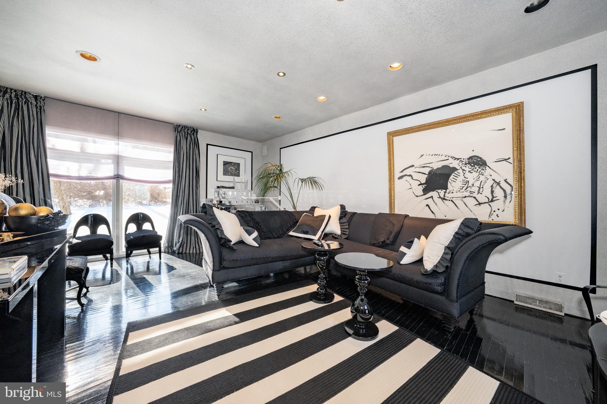 1335 Valley Road Villanova, PA 19085 - Photo 7 of 27 a living room with furniture a table and a large window