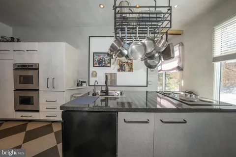 a kitchen with a sink and cabinets
