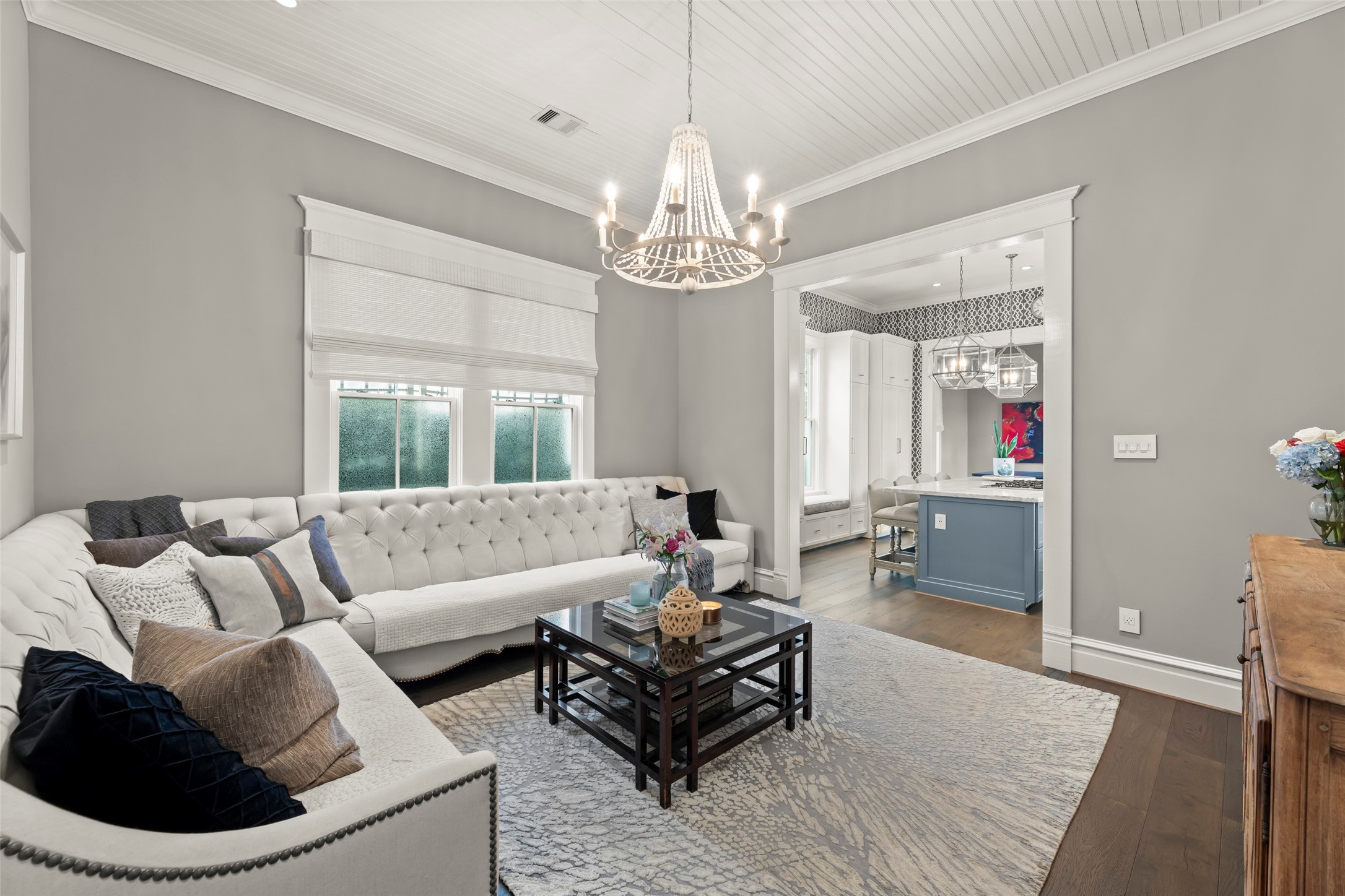1810 Kane Street Houston, TX 77007 - Photo 13 of 47 a living room with furniture and a chandelier