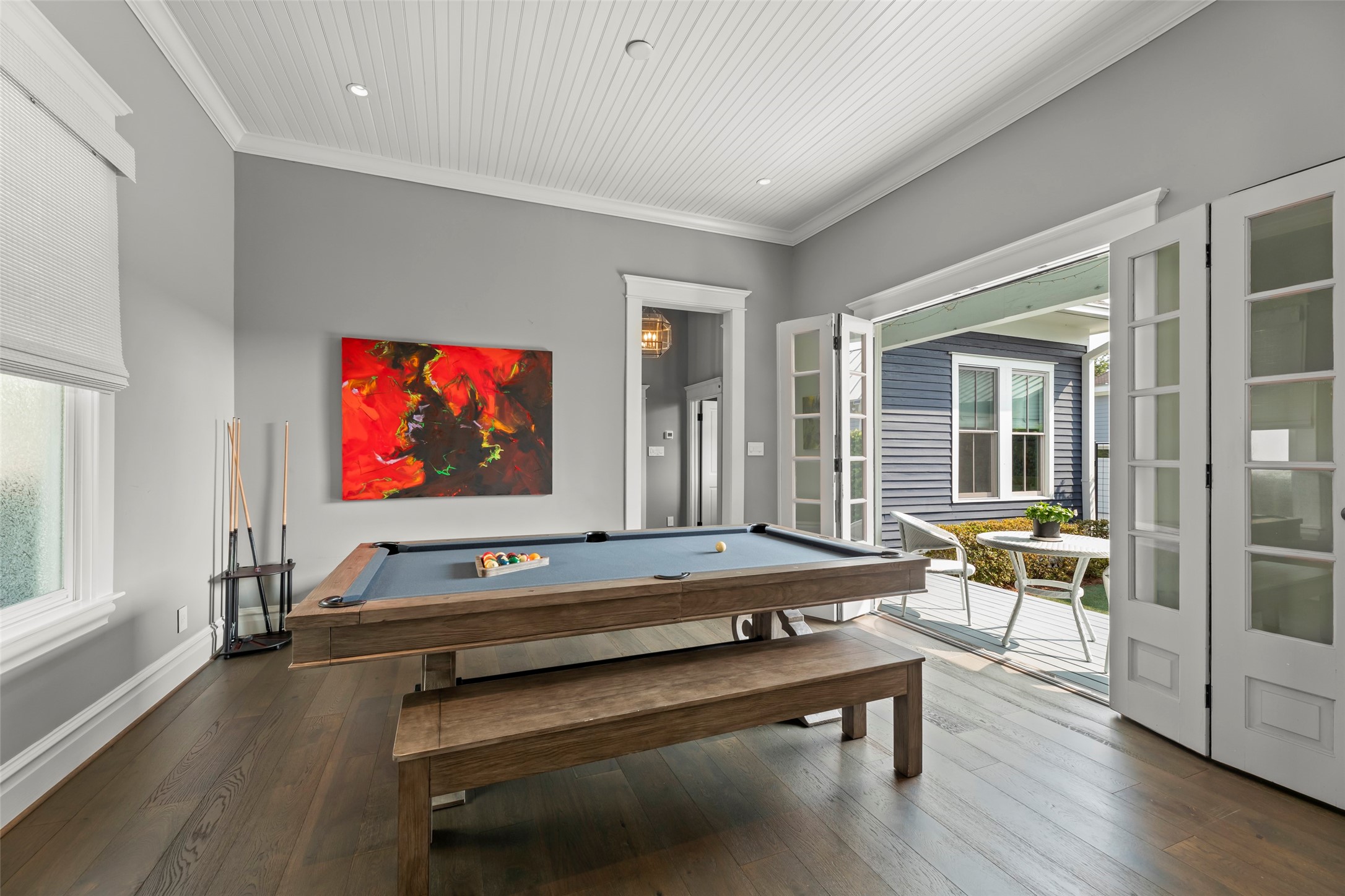 1810 Kane Street Houston, TX 77007 - Photo 20 of 47 a living room with furniture pool table flat screen tv and wooden floor
