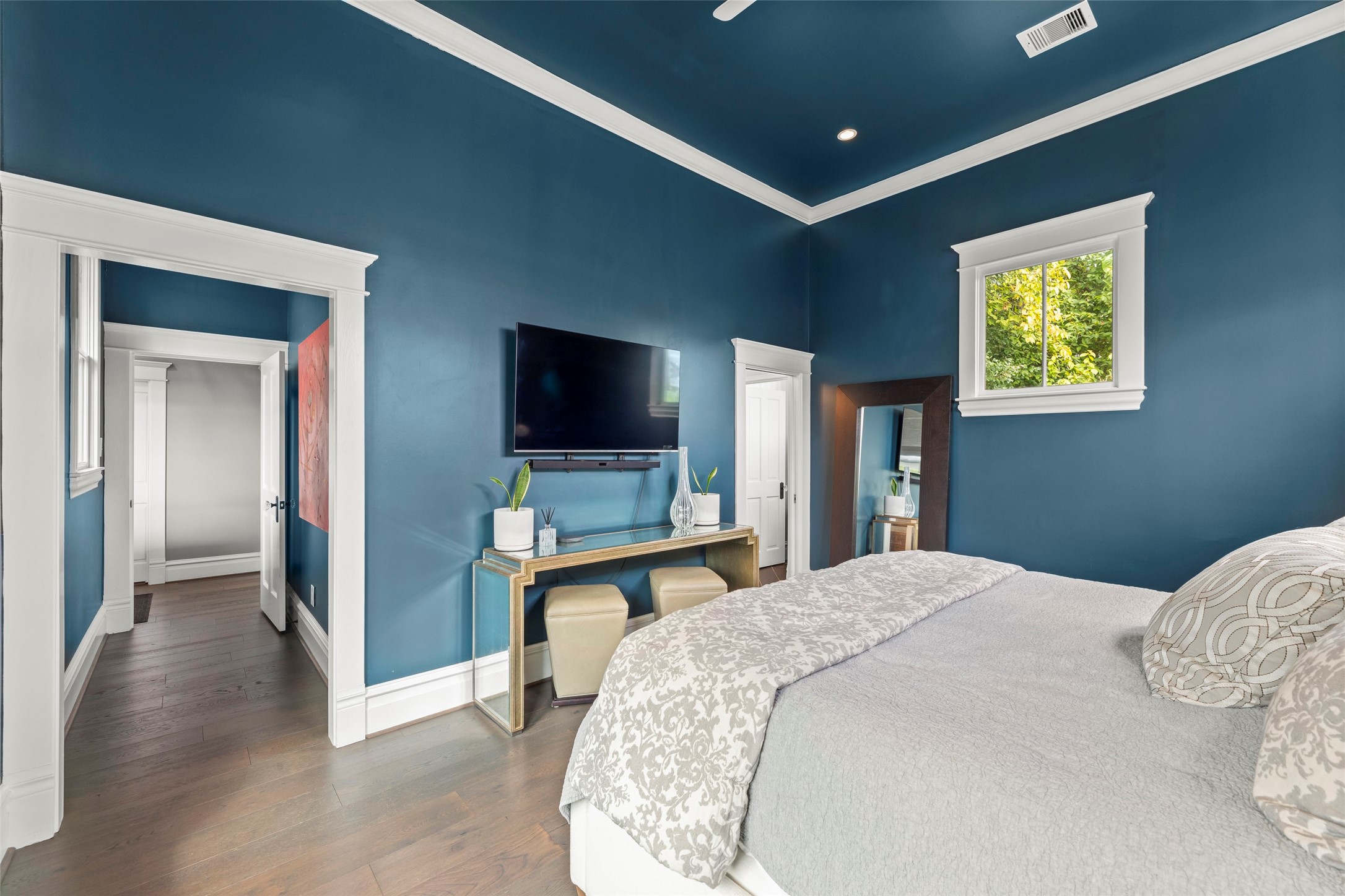 1810 Kane Street Houston, TX 77007 - Photo 22 of 47 a bedroom with a bed and a flat screen tv