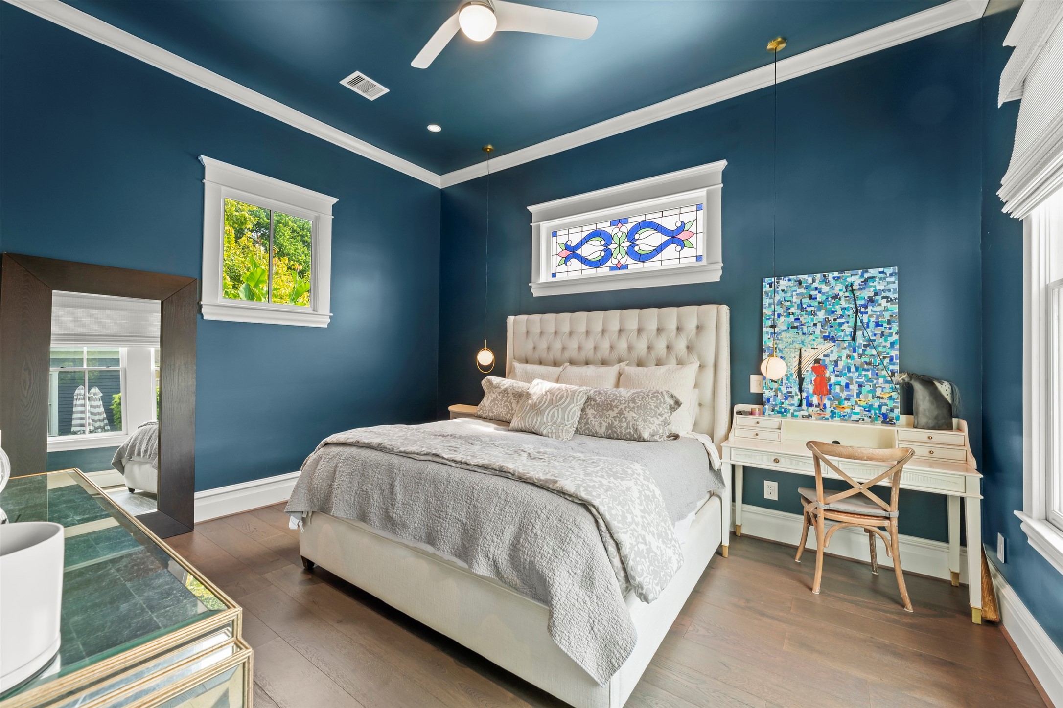 1810 Kane Street Houston, TX 77007 - Photo 23 of 47 a bedroom with a bed and a painting on the wall