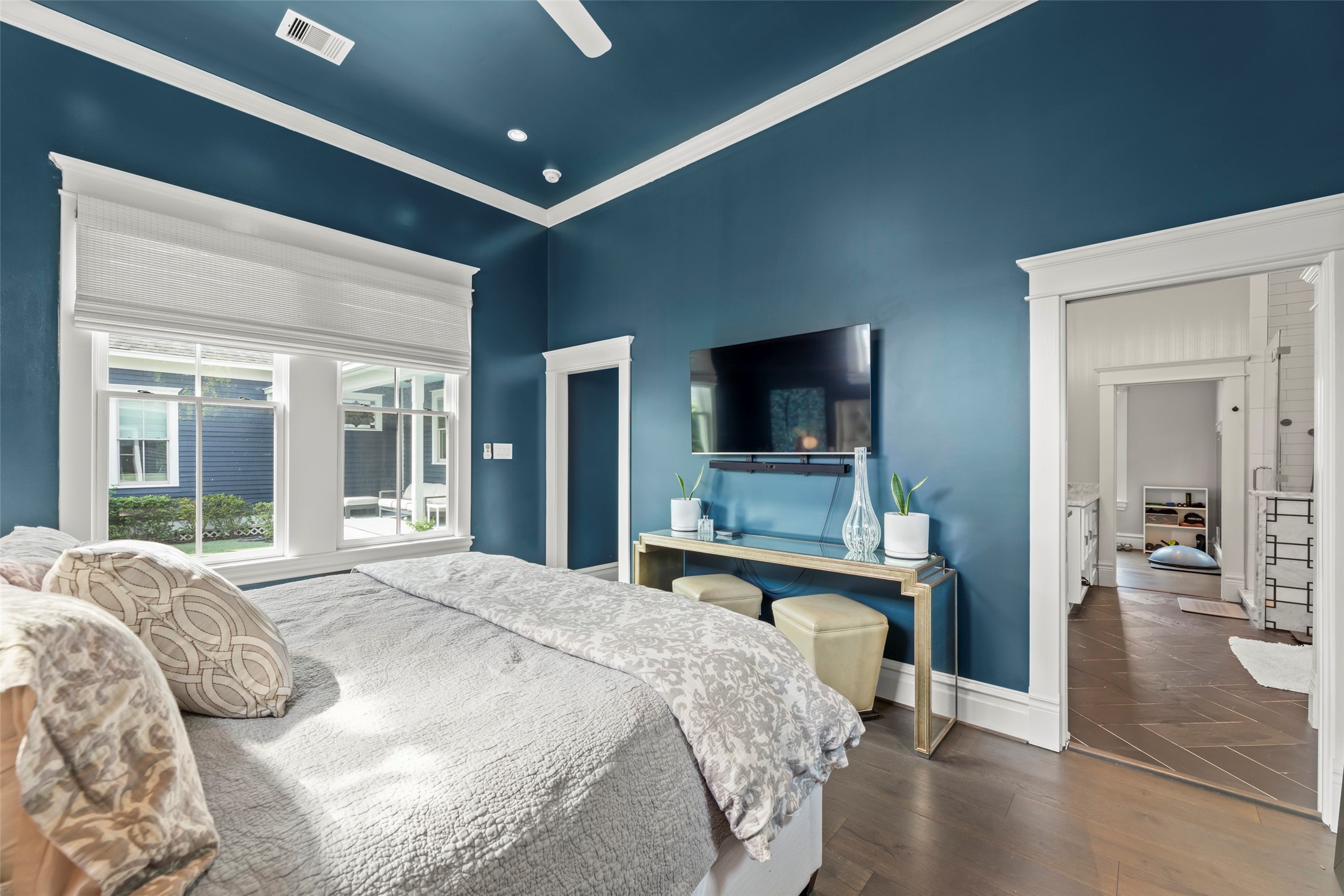 1810 Kane Street Houston, TX 77007 - Photo 25 of 47 a bedroom with a bed and a flat screen tv