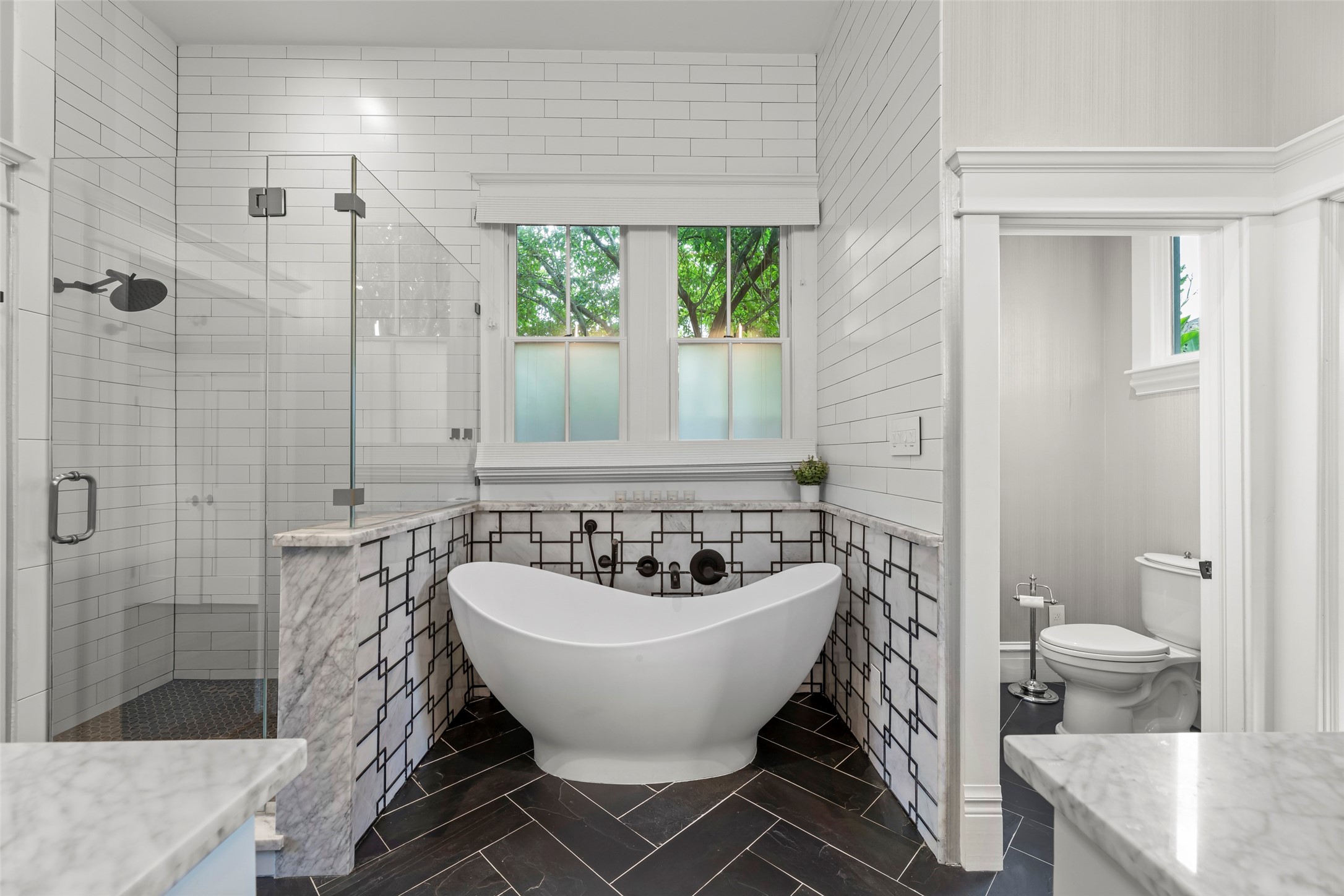 1810 Kane Street Houston, TX 77007 - Photo 27 of 47 a spacious bathroom with a bathtub and shower