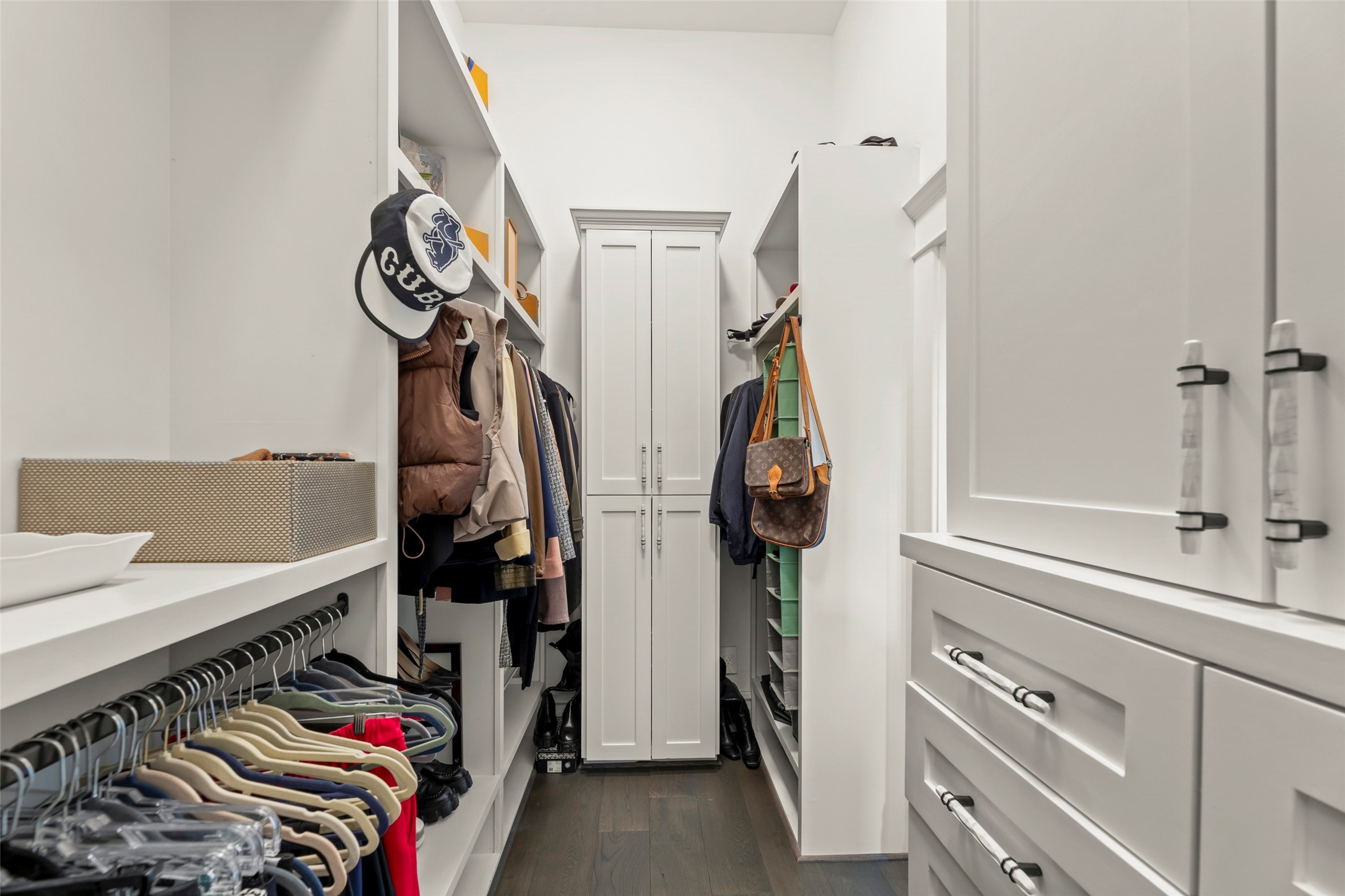 1810 Kane Street Houston, TX 77007 - Photo 30 of 47 a view of walk in closet with clothes and shoes