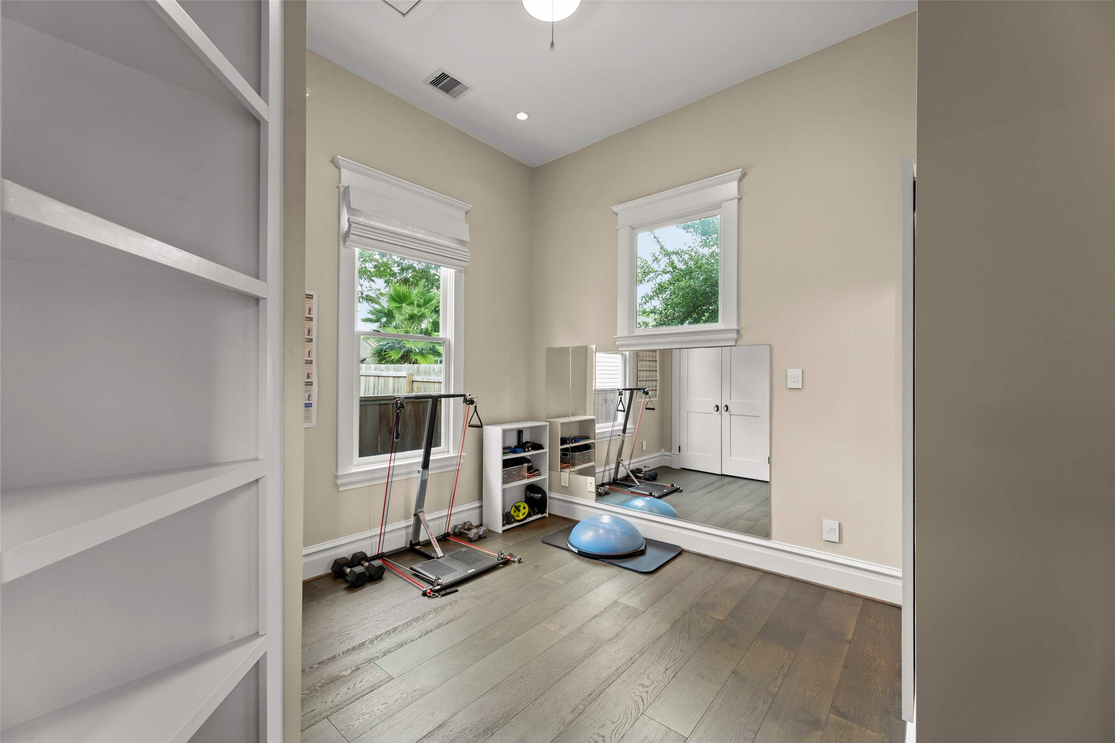 1810 Kane Street Houston, TX 77007 - Photo 31 of 47 a view of a room with gym equipment and windows