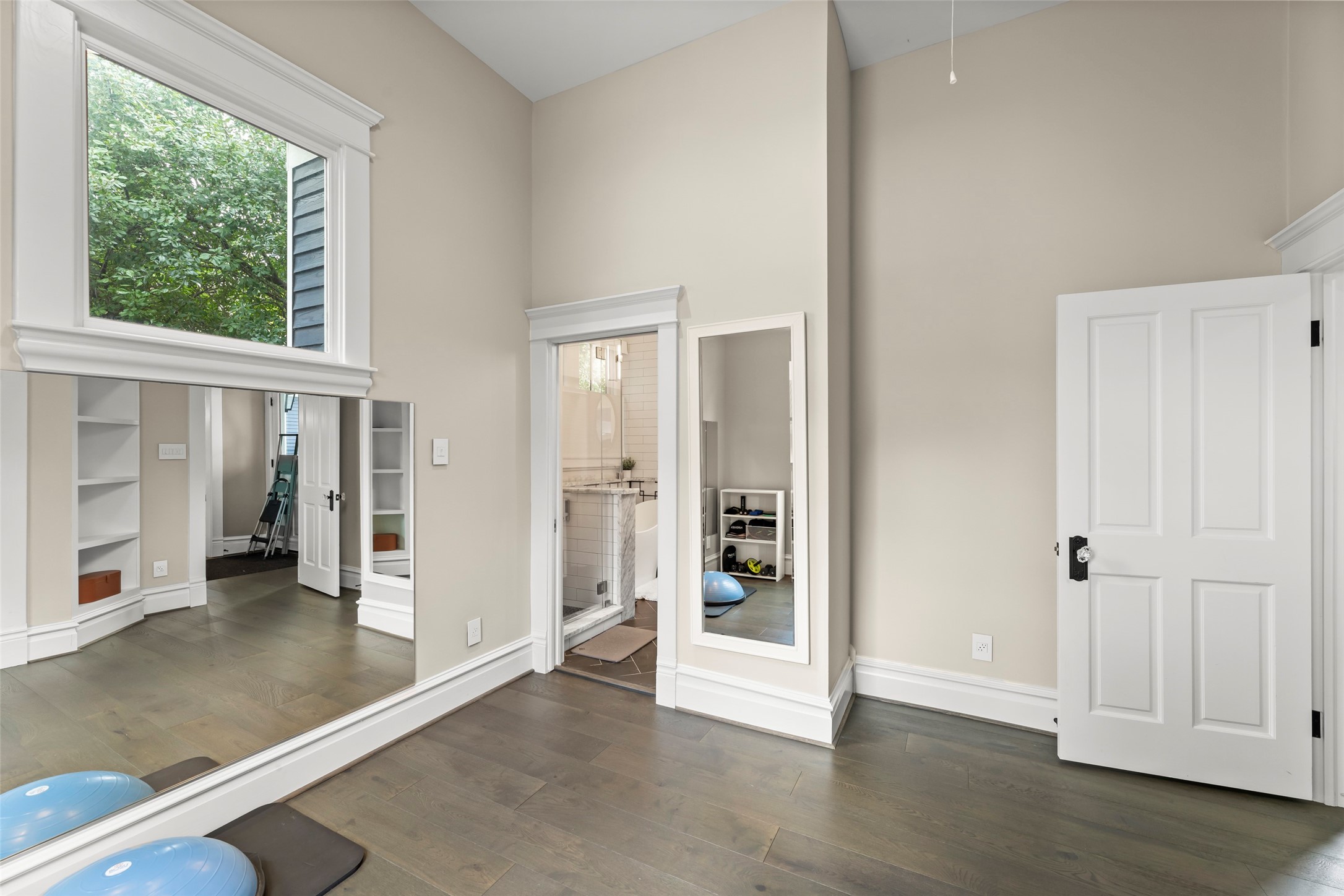 1810 Kane Street Houston, TX 77007 - Photo 32 of 47 an empty room with large windows and entrance