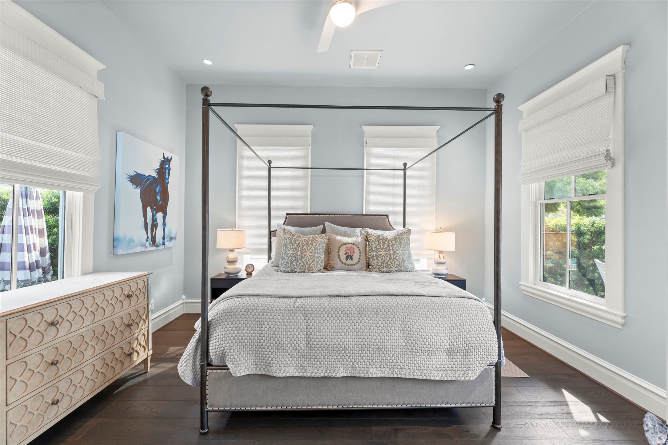 1810 Kane Street Houston, TX 77007 - Photo 5 of 47 a bedroom with a large bed and wooden floor