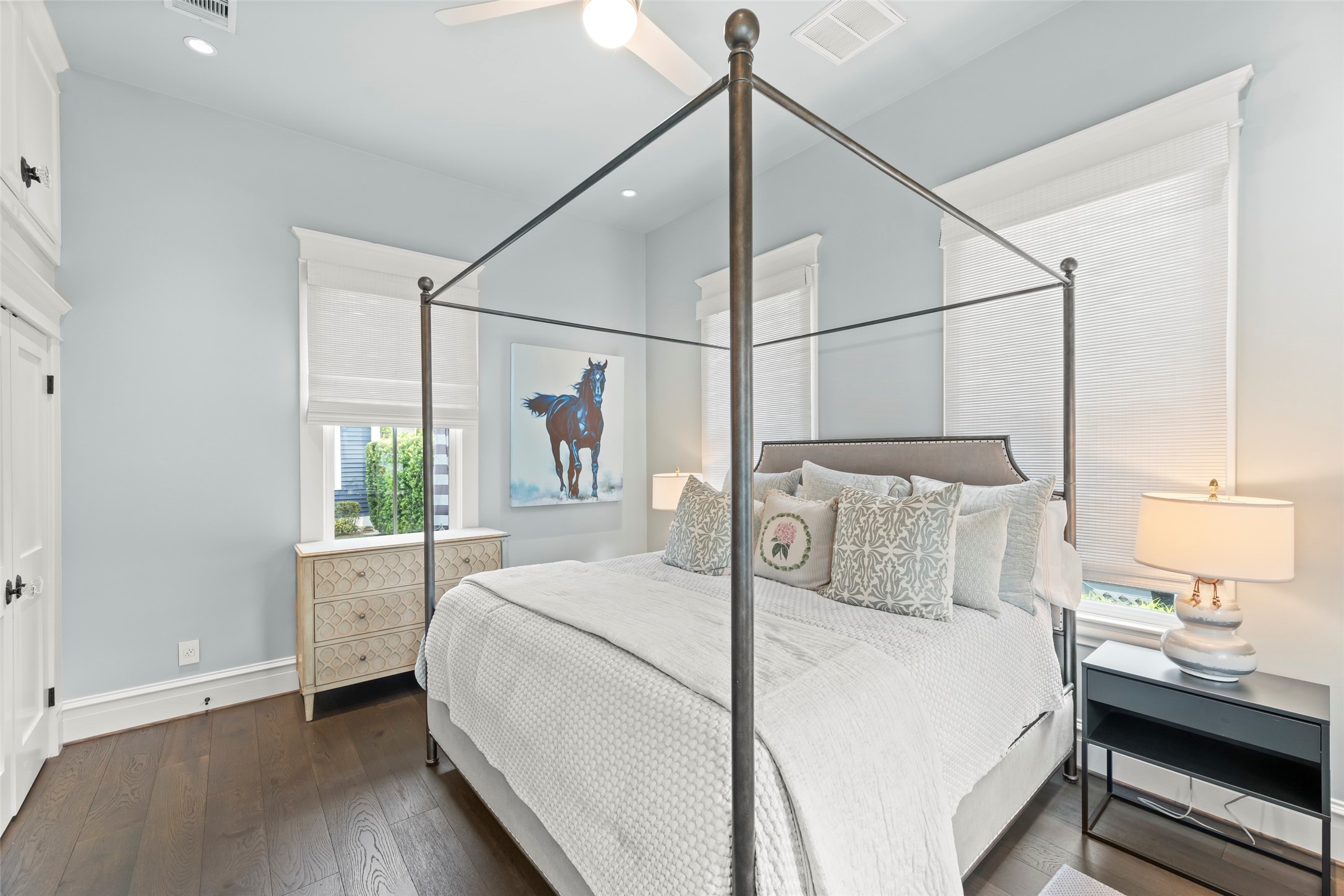 1810 Kane Street Houston, TX 77007 - Photo 6 of 47 a bedroom with a large bed and a chandelier