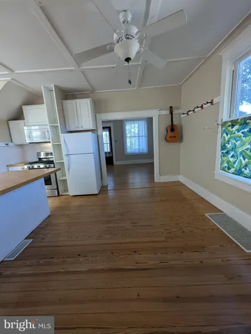 a view interior of a house kitchen wooden floor and window