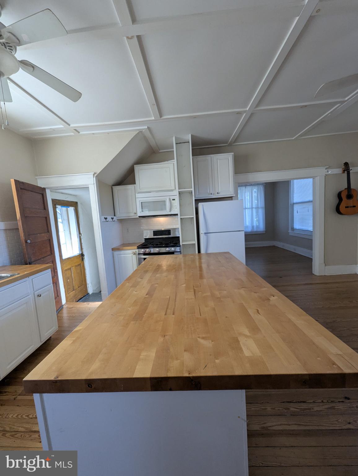 193 West Main Street Frostburg, MD 21532 - Photo 16 of 26 a bed sitting in a spacious bedroom next to a window