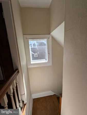 a view of a hallway view with staircase