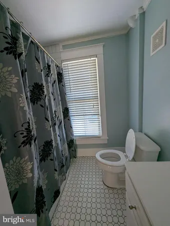 a view of balcony with wooden floor and fence