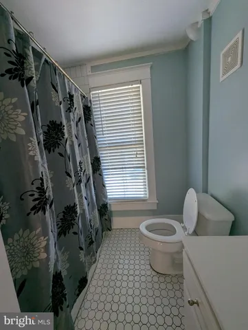 a view of balcony with wooden floor and fence