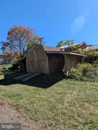 a view of a backyard of the house