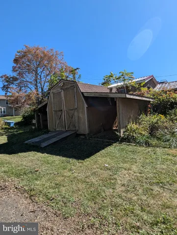 a view of a backyard of the house