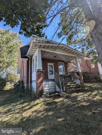 a view of a house with a tree