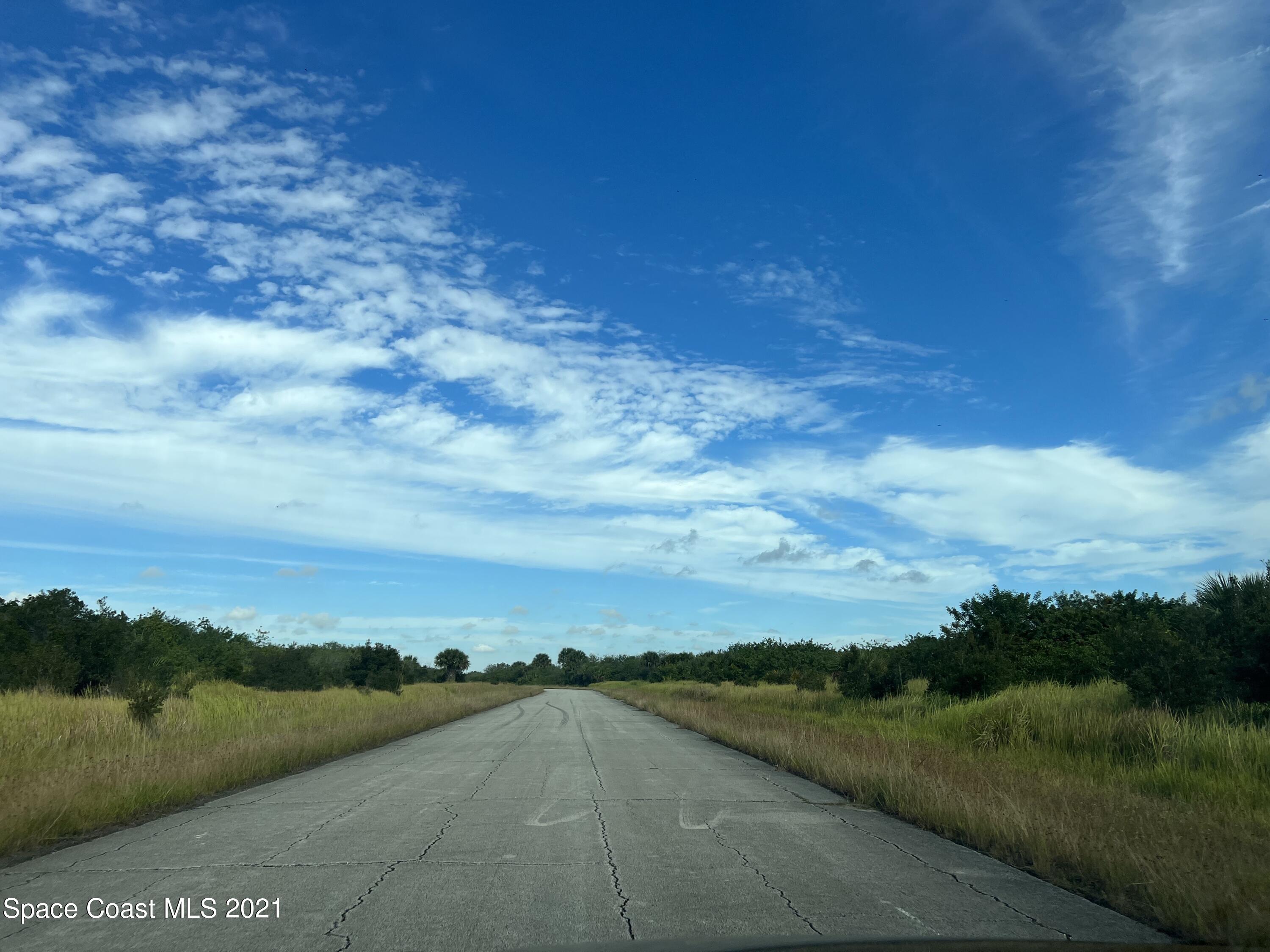 1210 Roland Street Southwest Palm Bay, FL 32908 - Photo 2 of 7 a view of a city with sunset view