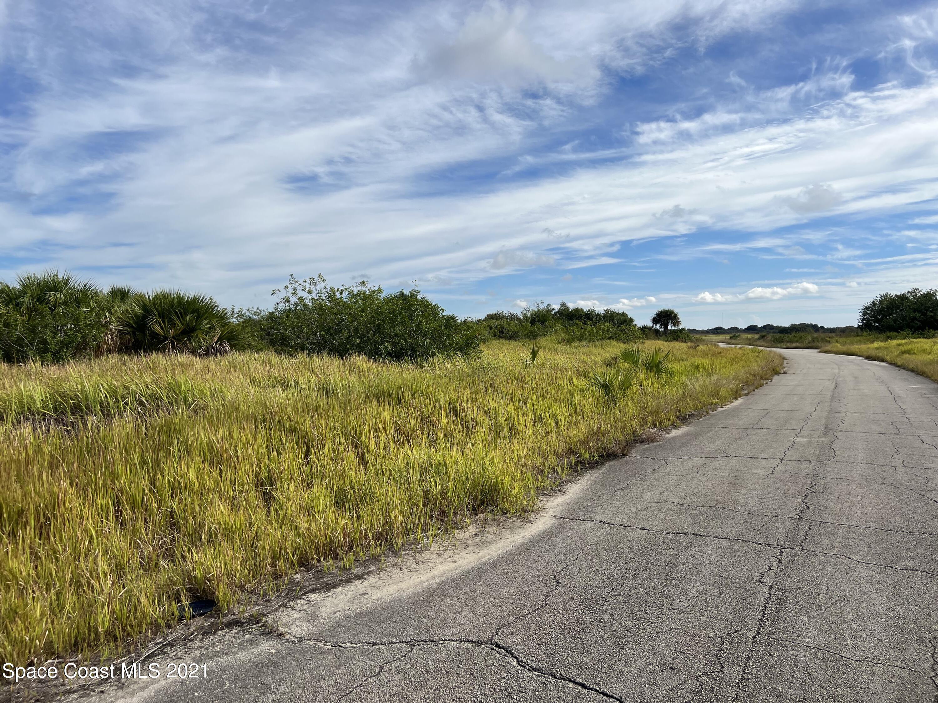 1210 Roland Street Southwest Palm Bay, FL 32908 - Photo 3 of 7 a view of an ocean and beach