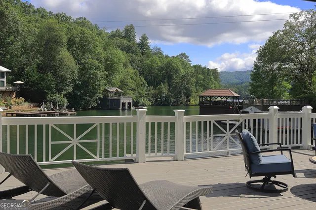 a view of a chair and table on the deck