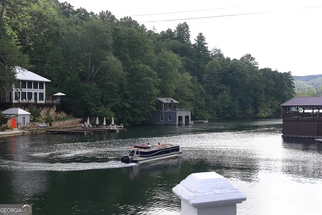 a swimming pool view with a outdoor seating