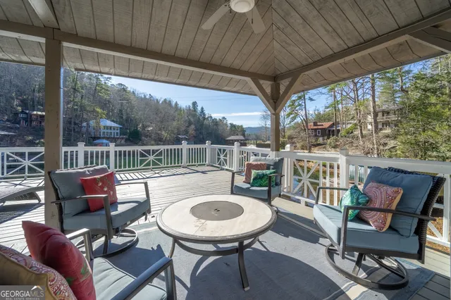 a view of a patio with a table chairs and a backyard