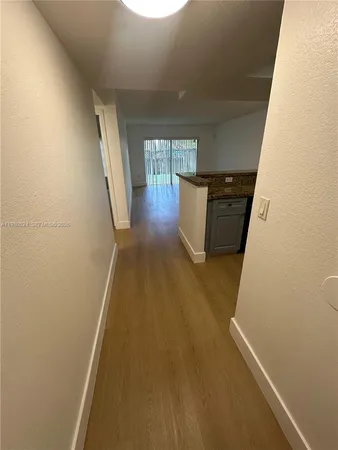 a view of entryway with kitchen