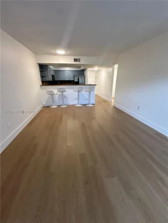 a view of a kitchen with a sink and a microwave