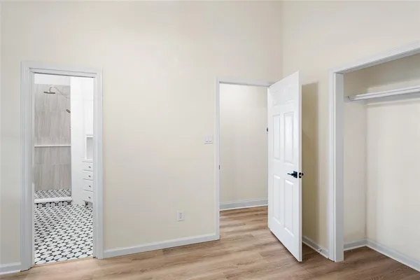 a view of a bathroom with wooden floor