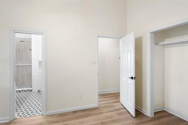 a view of a bathroom with wooden floor