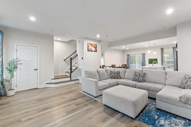 a white toilet sitting next to a shower