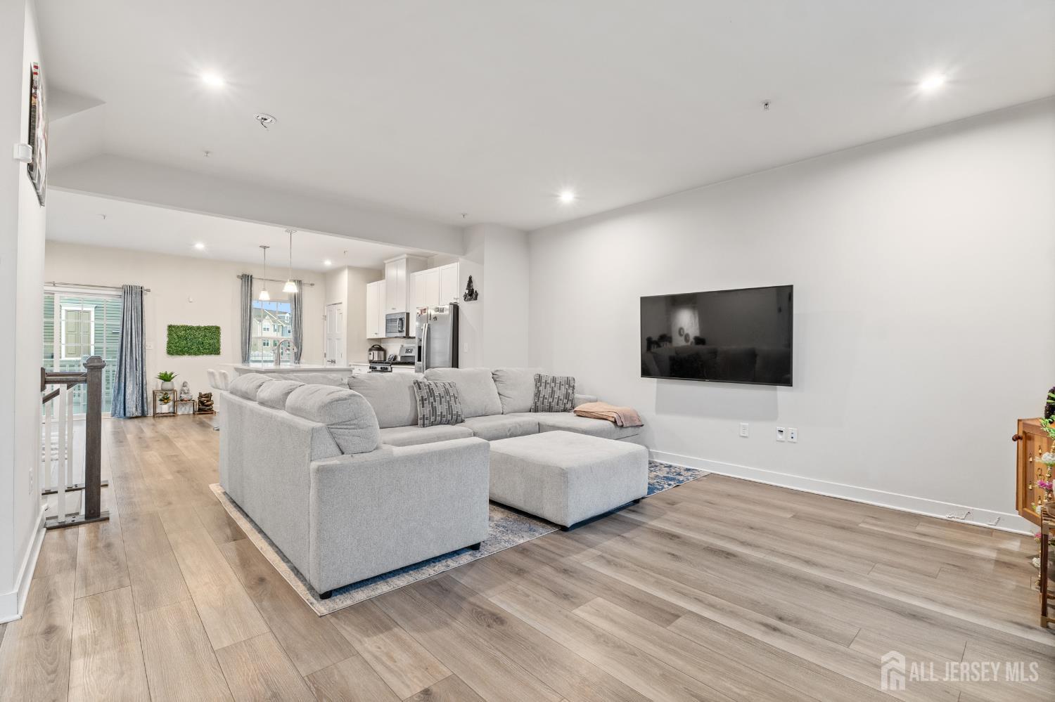 74 Anchor Way Cliffwood, NJ 07721 - Photo 12 of 35 a living room with furniture and a flat screen tv