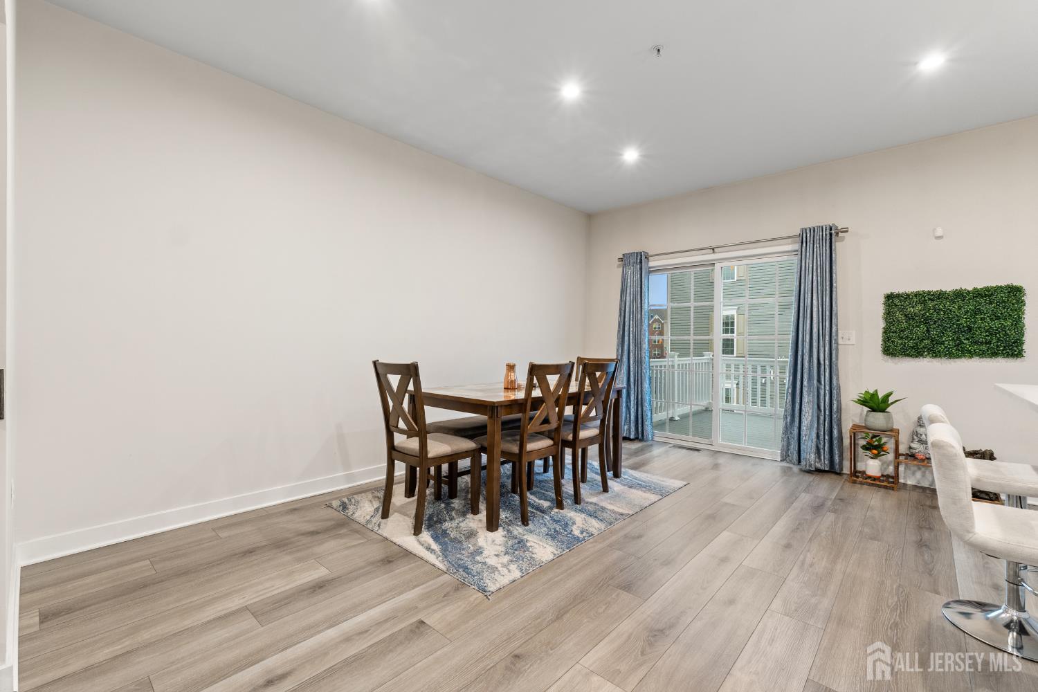 74 Anchor Way Cliffwood, NJ 07721 - Photo 13 of 35 a view of a dining room with furniture and wooden floor